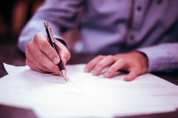 Man writing on a paper