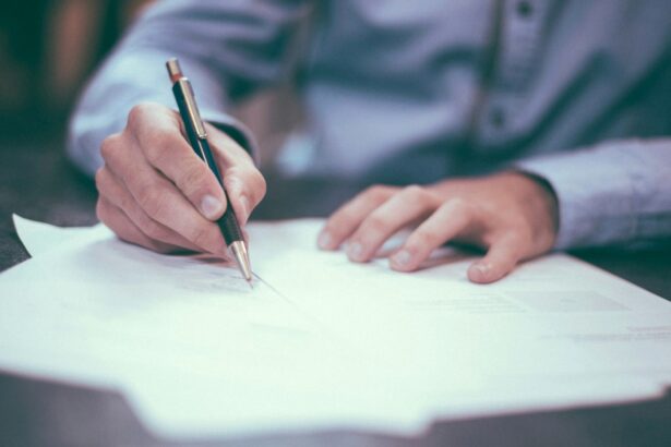 Man signing a set of papers
